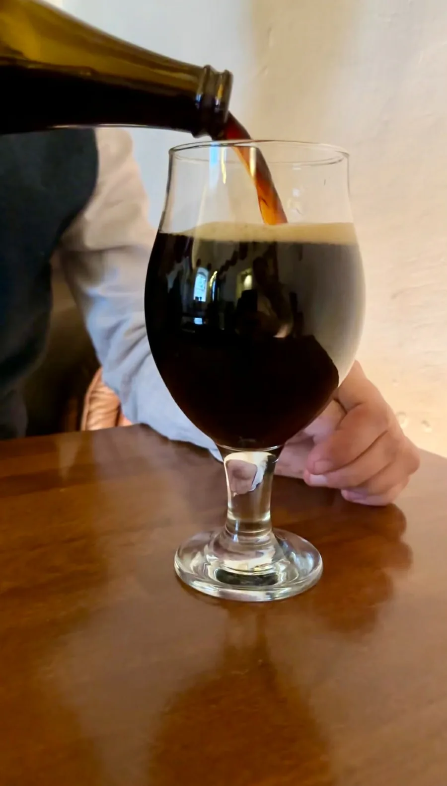 Dark Polish beer being poured during a tasting